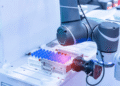 A Lab Robot Found Four New Asymmetric Reactions in 30 Days, but Humans Set the Rules